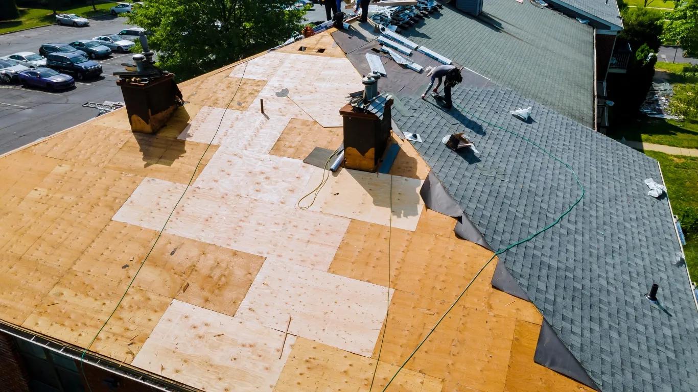 a roof with new shingles being installed